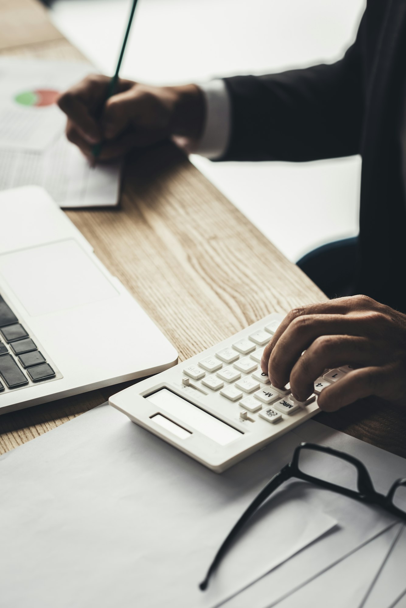 cropped shot of accountant using calculator